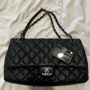 Authentic CHANEL flap bag. Black Caviar leather. Silver hardware.